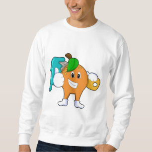 Orange som målarfärg med färgpensel lång ärmad tröja