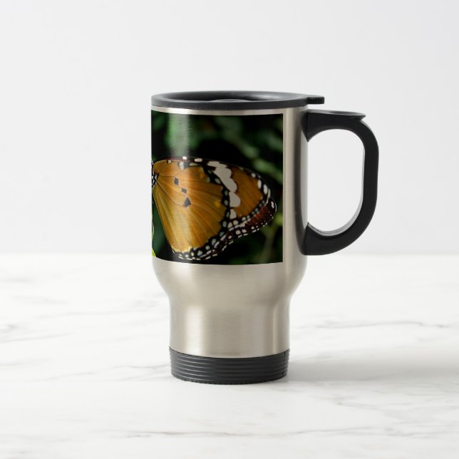 Orange, svart och vit fjäril på blad resemugg (Höger)