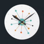 Orange Turkos atomage Starburst Mid Century Rund Klocka<br><div class="desc">Den här färgstarka medelårhundradets moderna klocka har en atomstarst i turkosblått,  två nyanser av orange och gult,  med svart linjer för tillfället. Så roligt att lägga till i väggen!</div>