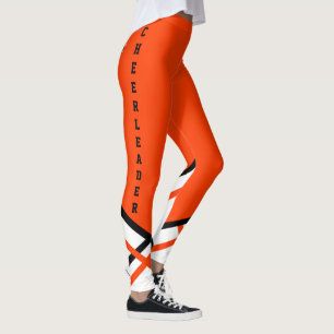 Orange, vit och svart ledare leggings
