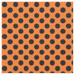 Orangen med svart Polka pricker tyg