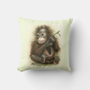 Orangutansbaby med blad kudde