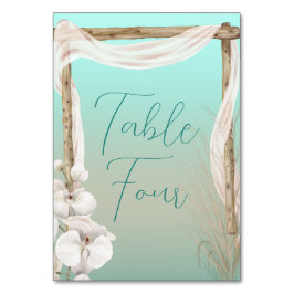Orchids & Boho Arch på Beach Wedding Bordsnummer