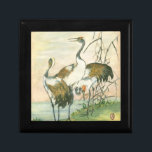 Orientala Cranes vid Vatten Smyckeskrin<br><div class="desc">Den här målningen av Vision Studio skulle ge perfekt för en fågelsamling. Den här bran av contemporary är en perfekt för ett fläkt som är orientaliskt och som består av vita kranar med svart och brunt vingar och detaljerna kommer att ge tecken till alla produkter som Zazzle ger.</div>