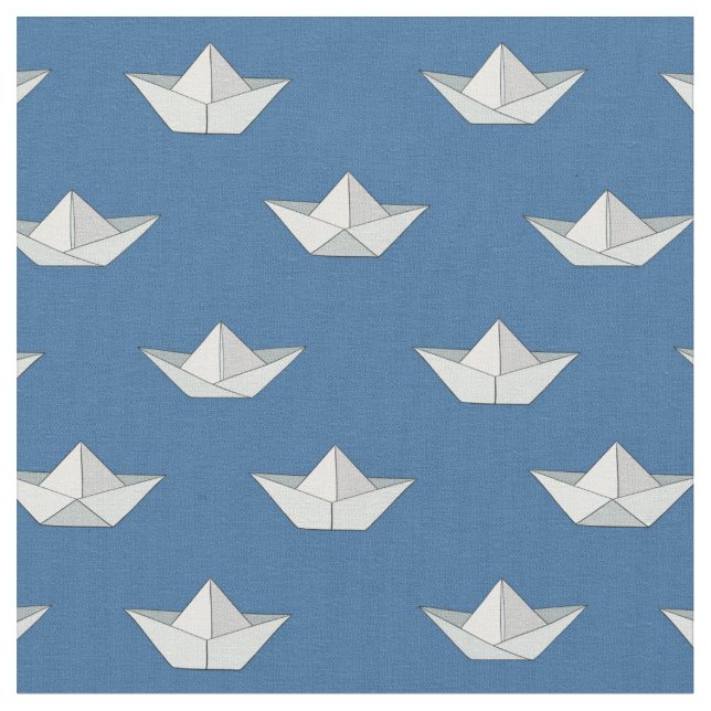 Origami fartyg på vattenmönster tyg (Närbild)
