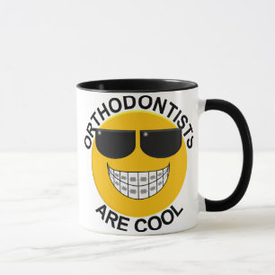 Orthodontists är den kalla ansiktekaffemuggen mugg