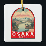 Osaka Japan Mount Fuji Travel Art Emblem Julgransprydnad Keramik<br><div class="desc">Färgdesign för Osaka-retro-vektor. Det är känt för sin moderna arkitektur,  nattliv och hjärtliga gatumat. 1600-talets shogunate Osaka Castle,  som har genomgått flera reparationer,  är dess viktigaste historiska landmärke.</div>