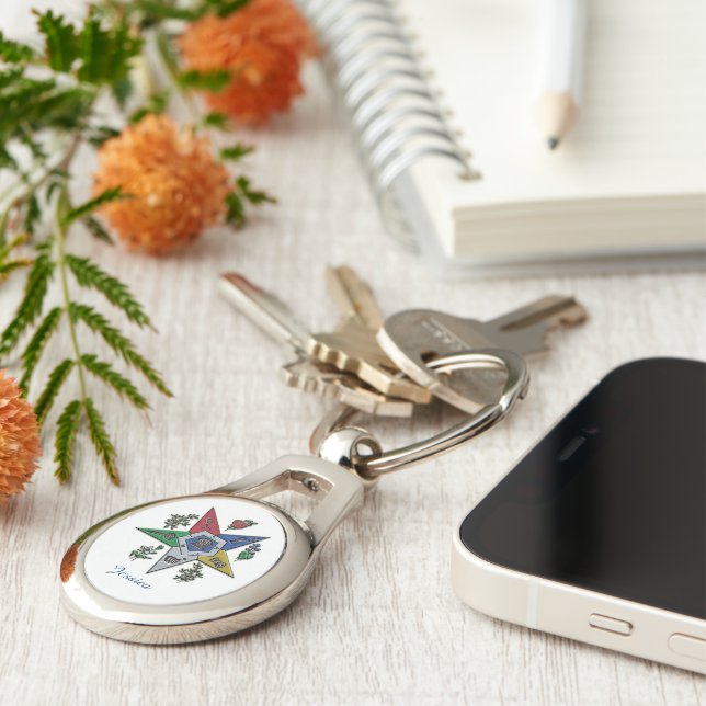 Östrans stjärnordning ovalt silverfärgad nyckelring (Sidan)