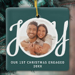 Our 1st Christmas Engaged Photo Green Keepsake Julgransprydnad Keramik<br><div class="desc">This keepsake First Christmas Engaged photo ornament is decorated with the word JOY in stylish script typography on a green background. Easily customizable.</div>