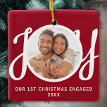 Our 1st Christmas Engaged Photo Red Keepsake Julgransprydnad Keramik<br><div class="desc">This keepsake First Christmas Engaged photo ornament is decorated with the word JOY in stylish script typography on a red background. Easily customizable.</div>