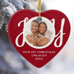 Our First Christmas Engaged Photo Red Heart-Shaped Julgransprydnad Keramik<br><div class="desc">This keepsake red heart-shaped First Christmas Engaged photo ceramic ornament is decorated with the word JOY in stylish white script typography. Easily customizable.</div>