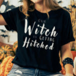 Our Witch Is Getting Hitched Bridal Party Tee<br><div class="desc">Celebrate your favorite witchy bride-to-be with this “Our Witch Is Getting Hitched” t-shirt, perfect for the bridal party at Halloween bachelorette parties and spooky bridal showers. Featuring bold white lettering on black, these tees create a fun, unified look alongside the bride’s “This Witch Is Getting Hitched” shirt. Comfortable and festive,...</div>