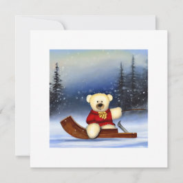 Ourson sur une luge dans la neige