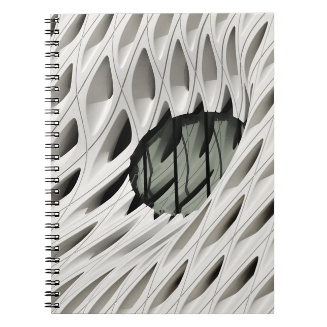 Oval svart färgtonsglasruta på vitt yta anteckningsbok (Framsidan)