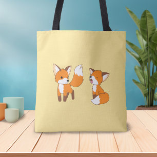 Pair of Cute Little Foxes on Gult Tygkasse