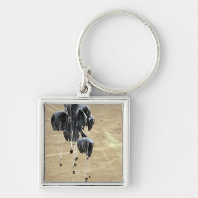 Paket för containerleveranssystem i fallskärm fyrkantig silverfärgad nyckelring (Framsidan)