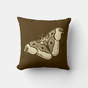 Päls, brun choklad och beige kudde