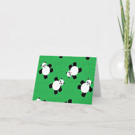 Pandabjörn som lägger gräs kort