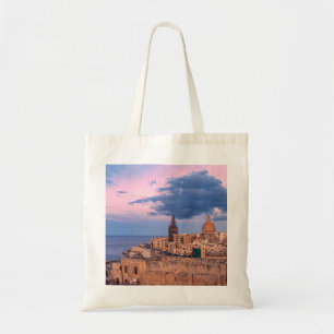 Panoramisk syn på solnedgång över Valletta Tygkasse