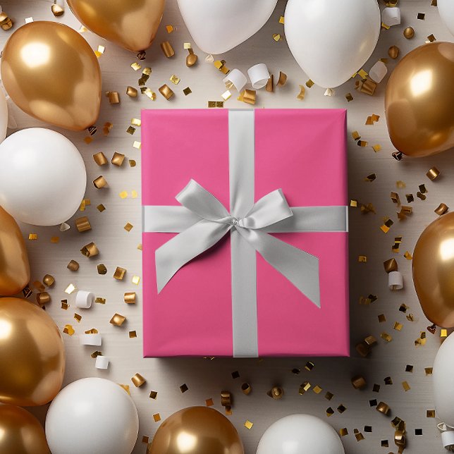 Papper utrullning av shock rosa presentpapper (Skapare uppladdad)