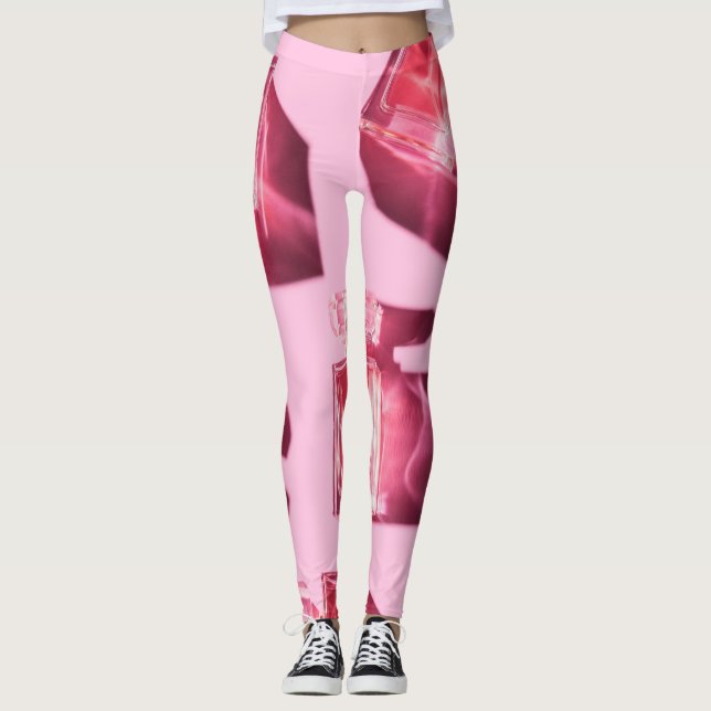 Parfym flaskor, rosa bakgrund, flatlay leggings (Framsida)