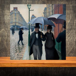 Paris Street in Rainy Weather - Gustave Caillebot Kakelplatta<br><div class="desc">This beautiful vintage look decorative tile features a portion of Paris Street in Rainy Weather, a fine art canvas print by Gustave Caillebotte. In French, the work is called Rue de Paris, temps de pluie), and it's a large 1877 oil painting. Believed to be his best known work, it shows...</div>