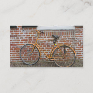 Parkerad cykel och kort för foto för tegelstenv