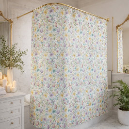 Påskägg i pastellfärger och vårblommig mönster