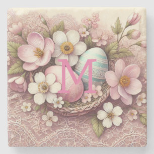 Påskägg vid Monogram snöre rosa blommigt i basket Stenunderlägg