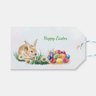 Påskhare, färgrika ägg och daisy presentetikett