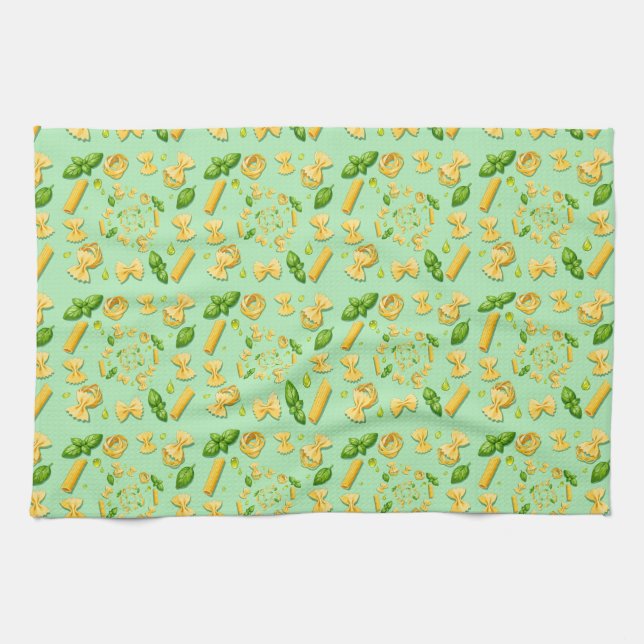 Pasta and basil leaves on green kökshandduk (Horisontell)