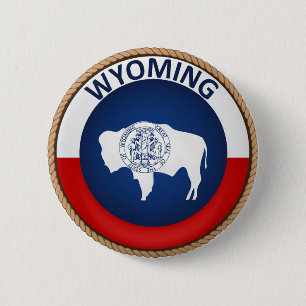 Påstå av den Wyoming flagga förseglar knäppas Knapp