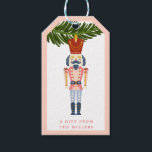 Pastel Nutcracker-julets Personlig Ornament Presentetikett<br><div class="desc">Denna vintage julprydnadsdesign ger alla dessa bra nostalgia-vibes från dagar borta av. Framsidan av den här presentens märkre har en nötkrackande ornament som hänger från Julgran gren. Kortets baksida har en rosa bakgrund med en röd stjärna mönster. Du kan anpassa med ditt efternamn.</div>