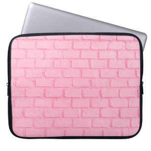 Pastel rosa brick bakgrundsvägg struktur. rosa är laptop fodral