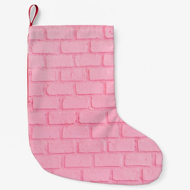 Pastel rosa brick bakgrundsvägg struktur. rosa liten julstrumpa (Framsidan)