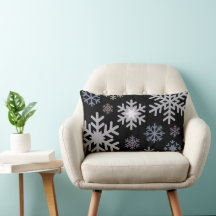 Pastellfärgade snöflingor på svart bakgrund