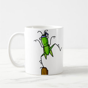 Patiensgräshoppan balanserar muggen kaffemugg