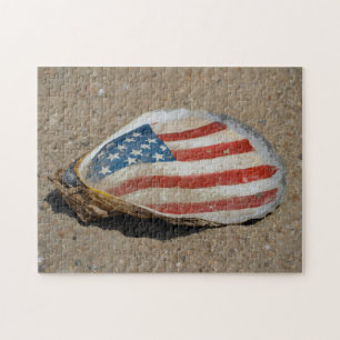 Patriotiskt amerikanskt flaggostronsskal på strand pussel
