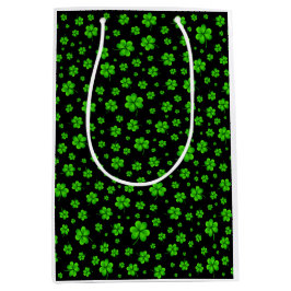Pattern of green shamrocks on black background