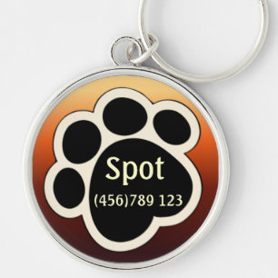 Pawprint solbränna & röd hundlegitimationmärkre rund silverfärgad nyckelring