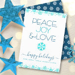 Peace Joy Kärlek Turcos Snowflake Typography fold Julkort<br><div class="desc">"Fred, glädje och kärlek." En roligt, lekfull, snöflingande illustration och modern typografi på vit bakgrund hjälper dig att sätta igång i julhelgen. Ytterligare faux turcoise foil snöflingor och konetti ger ram kortet. En vit snöflinga mönster överträffar mörk blått på baksidan. Känn helgdagarnas värme och glädje när du skickar det här...</div>