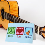 Peace Kärlek Guitar Helgkort<br><div class="desc">En coola guitaristisk julkort med fredstecken,  hjärta och gitarr på en vacker blå bakgrund. Ett sött musikinstrument lagrar helgdag kort som läser Peace Kärlek Guitar.</div>