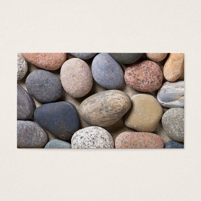 Pebble Stones on Sand for Background Visitkort (Framsidan)