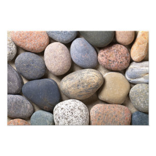 Pebblestenar på sanden för bakgrund fototryck