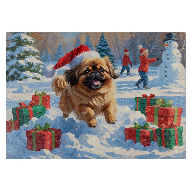 Pekingeserhund springer i snö med julhatt (Framsidan)
