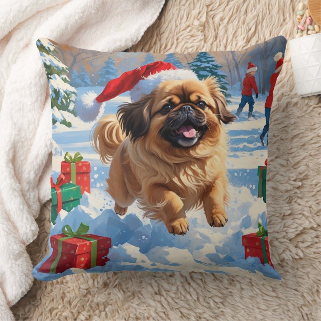 Pekingeserhund springer i snö med julhatt kudde (Filt)