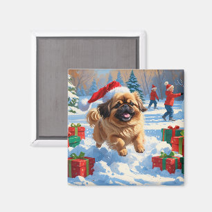 Pekingeserhund springer i snö med julhatt magnet