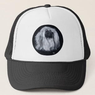 Pekingeserporträtt i svart och vitt keps