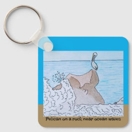 Pelikan vid sten nära vinkara havet nyckelring