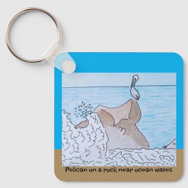 Pelikan vid sten nära vinkara havet nyckelring (Framsida)